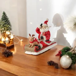 Resin Santa with Pig on Sled Figurine< Clearance